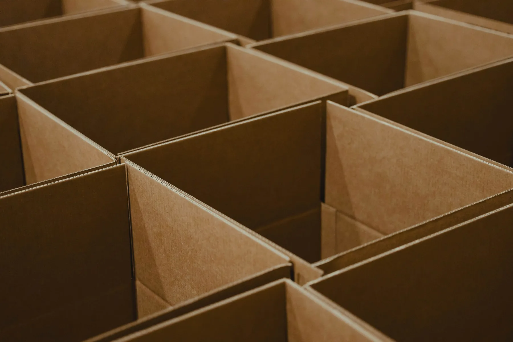 Corrugated board partitions stacked in a grid